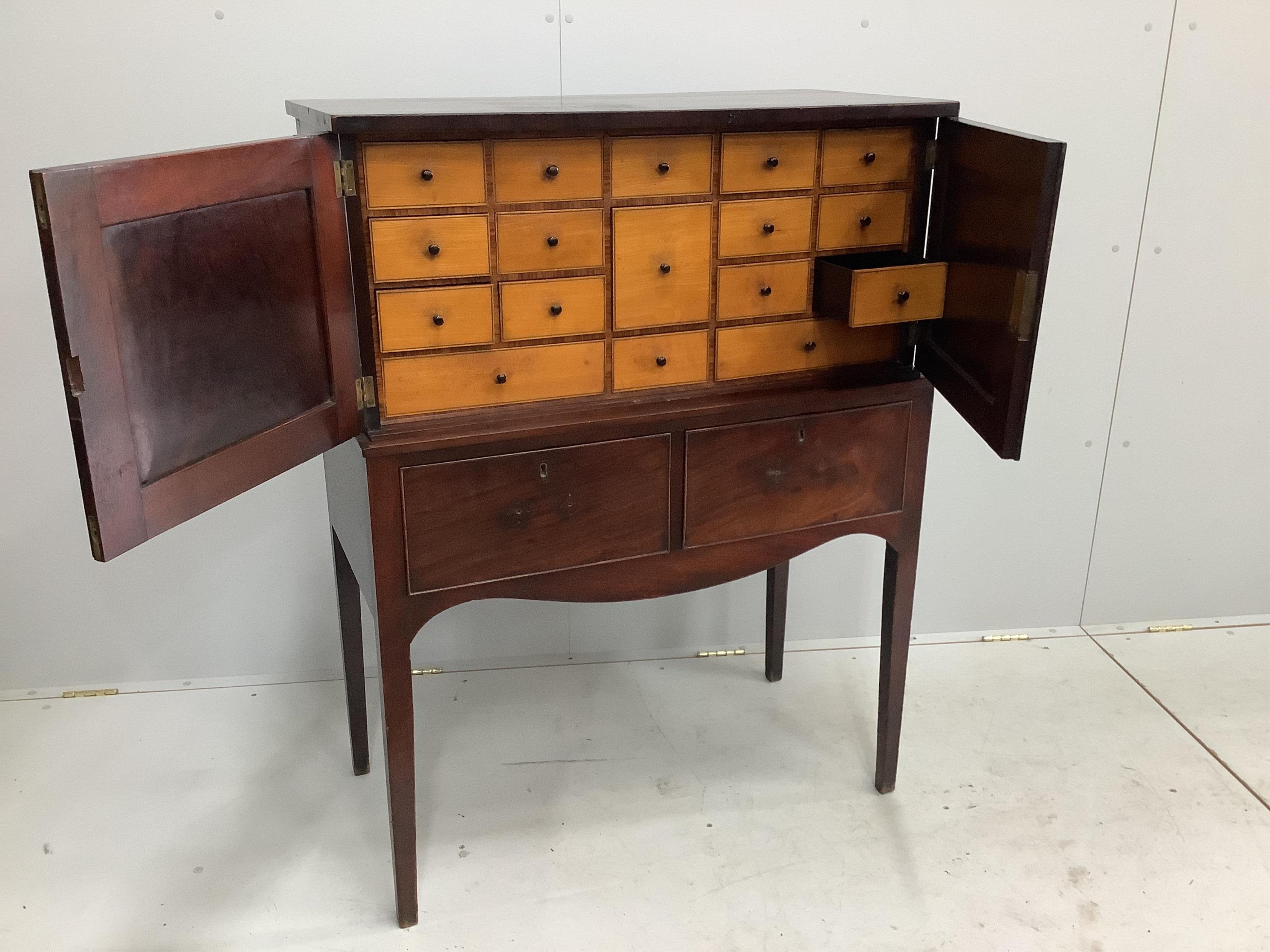 A George III collectors cabinet on stand, satinwood drawer fronts, ebony drawer linings, width 93cm, depth 46cm, height 122cm. Condition - fair